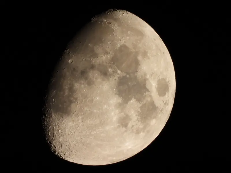 Detailed photograph of the waxing gibbous moon showcasing its craters and surface features