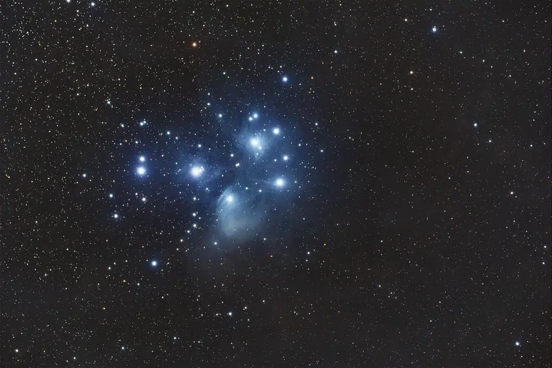 Captivating image of the Pleiades star cluster illuminating the night sky with a stunning cosmic display