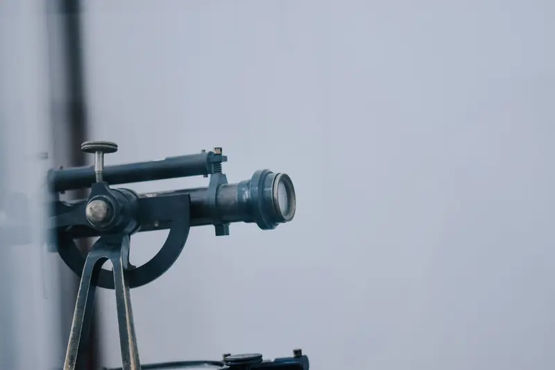 A close-up view of a vintage telescope lens showcasing intricate details and metal components