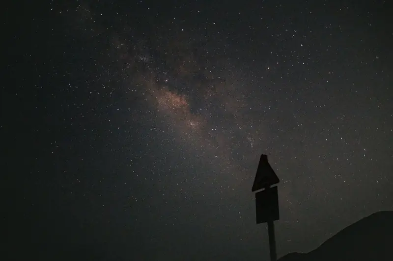 A mesmerizing view of the Milky Way galaxy under a dark, starry night sky